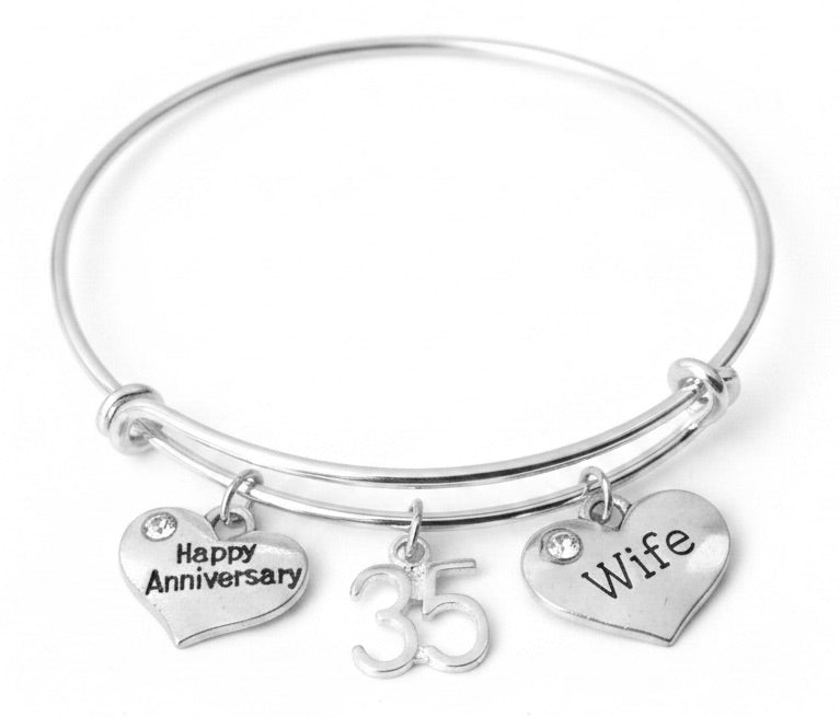 Silver expandable single wire bangle bracelet with three charms: Happy Anniversary heart charm with crystal, number 35 charm, and Wife heart charm with crystal accent — 35th anniversary gift for wife