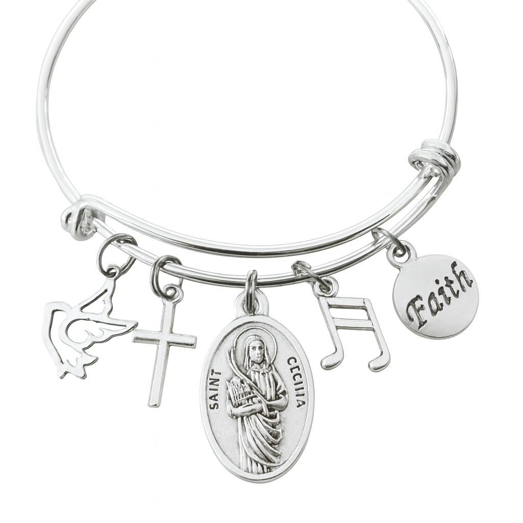 Silver Saint Cecilia bangle bracelet with angel, cross, music note and faith charms. A meaningful gift for musicians, choir members, and patron saint devotion.