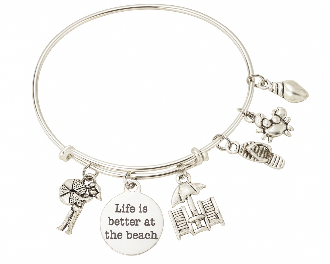 Silver bracelet with beach-themed charms and a 'Life is better at the beach' tag on a white background