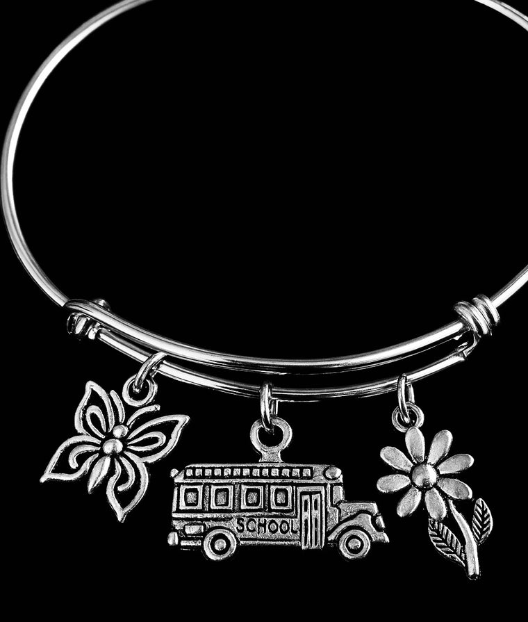 Adjustable School Bus Charm Bracelet with butterfly and flower charms. Silver bangle jewelry gift for teachers, bus drivers, or school staff appreciation.