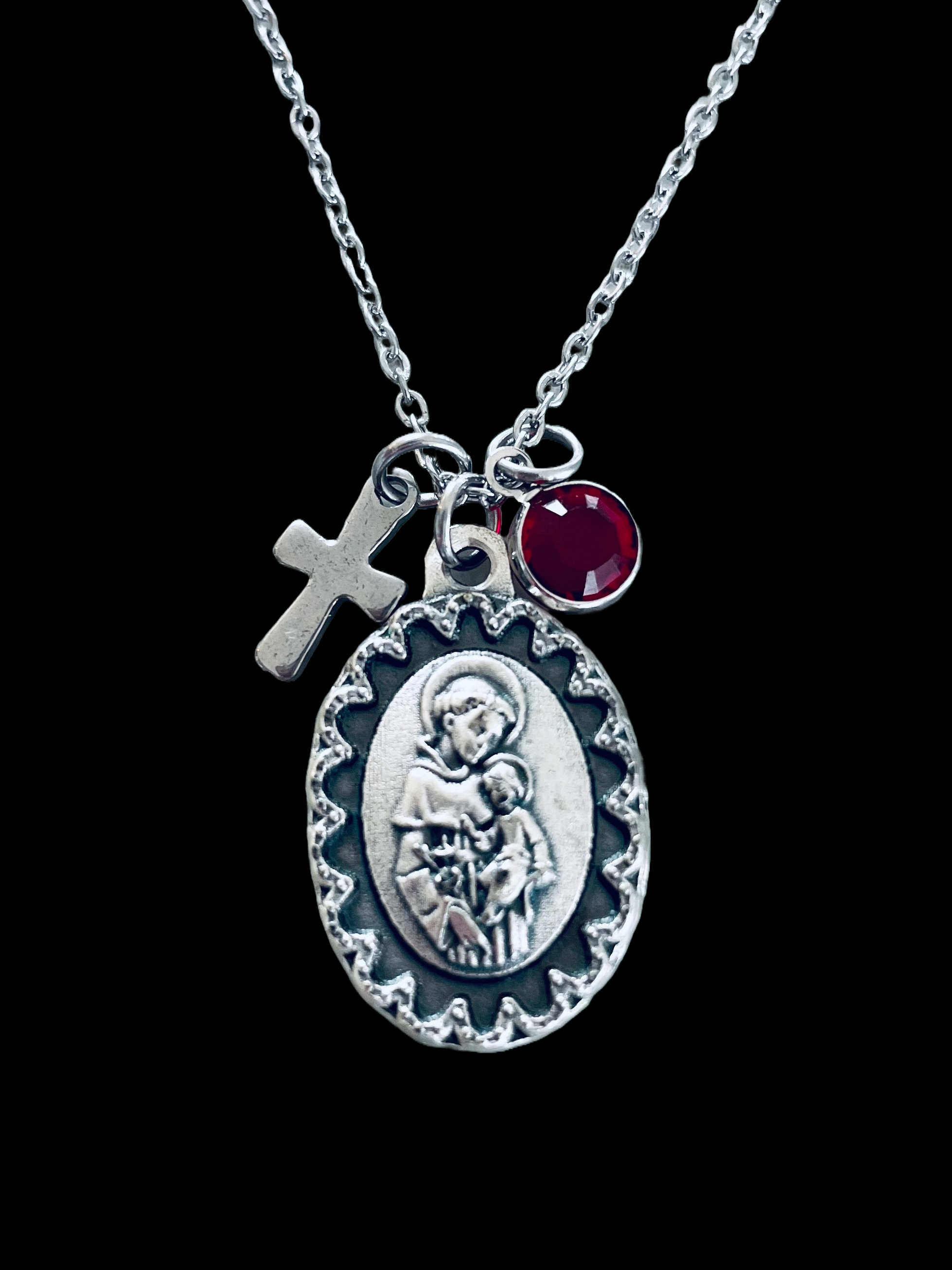 Saint Anthony medal necklace with cross charm and birthstone.