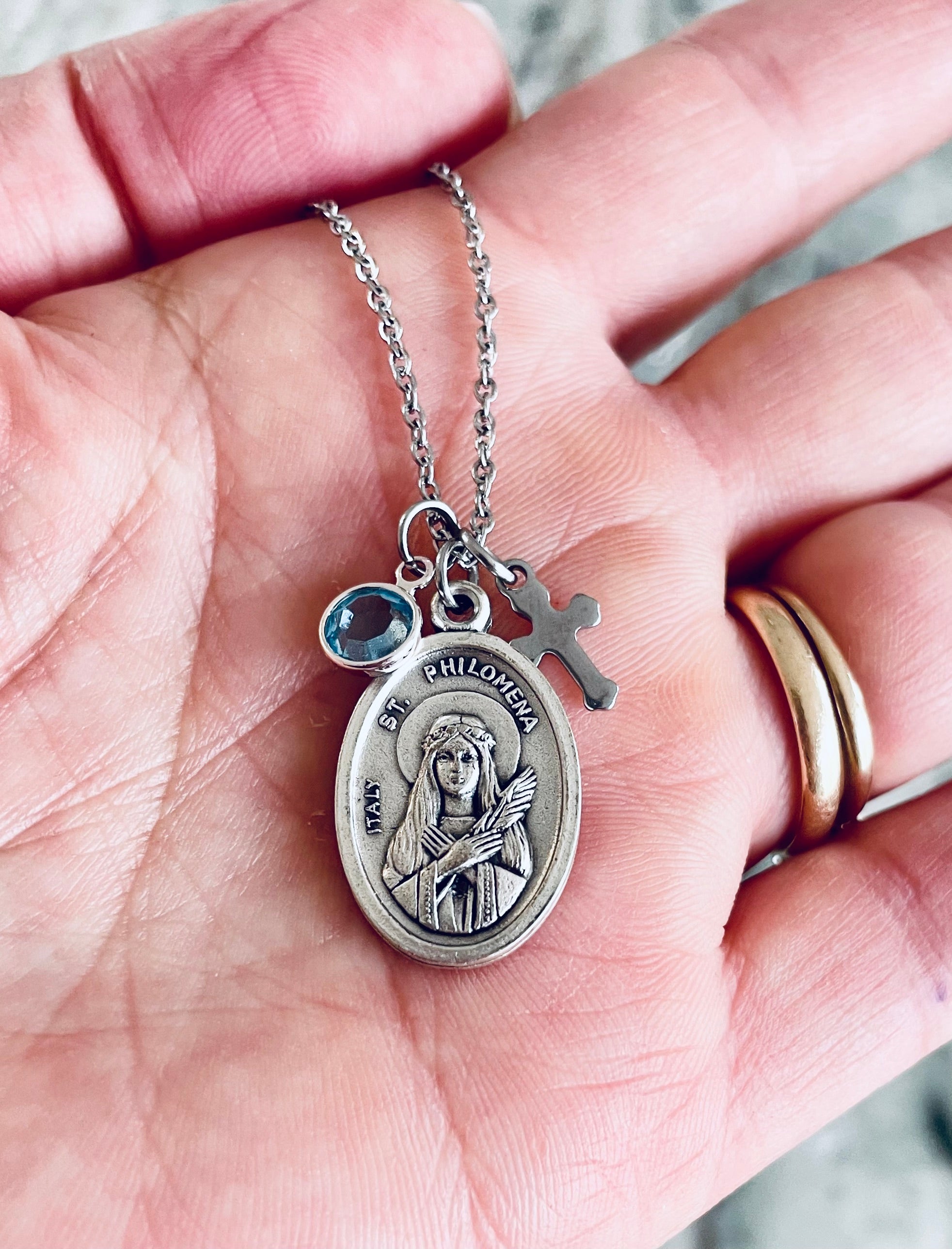 Catholic necklace featuring Saint Philomena, patron of children, with elegant birthstone accent