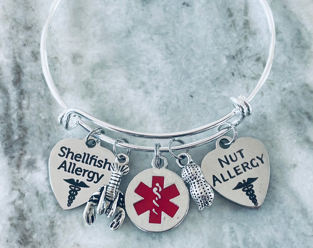 Silver medical alert bracelet with Shellfish Allergy and Nut Allergy charms, red medical symbol, lobster and peanut charms for allergy safety