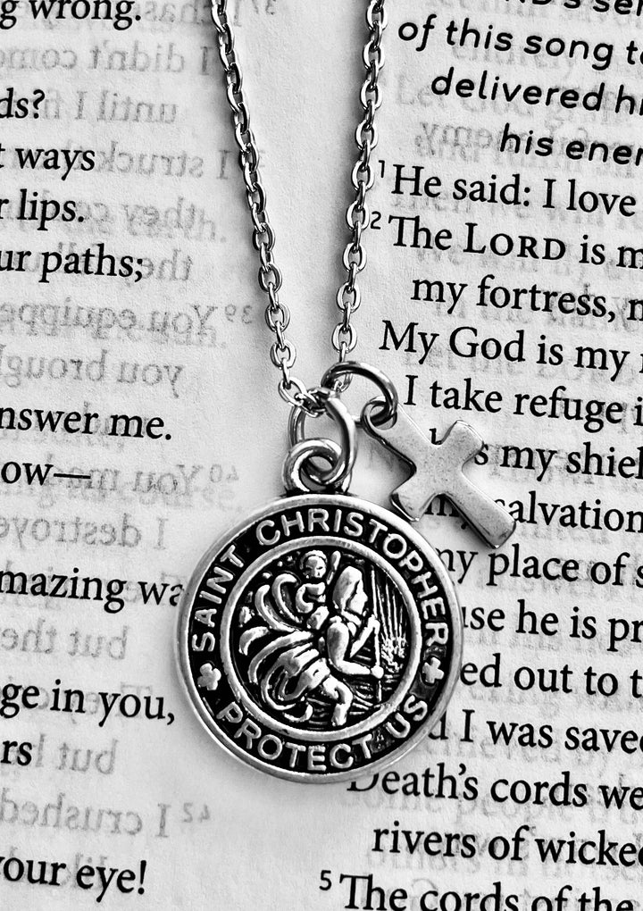 Saint Christopher medal cross and the words &
