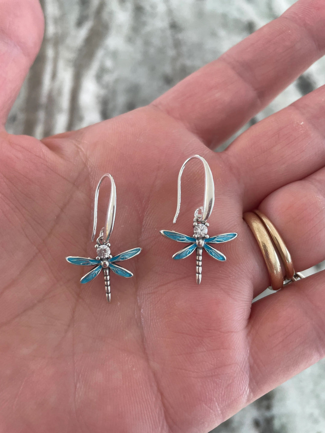 blue dragonfly drop earrings in sterling silver with cubic zirconia accent stones and curved ear wires