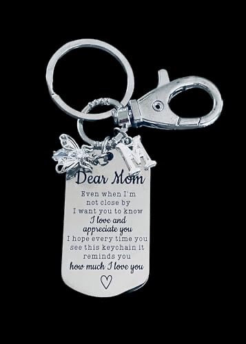 A silver keychain with a crystal bee design and a personalized message tag that reads &