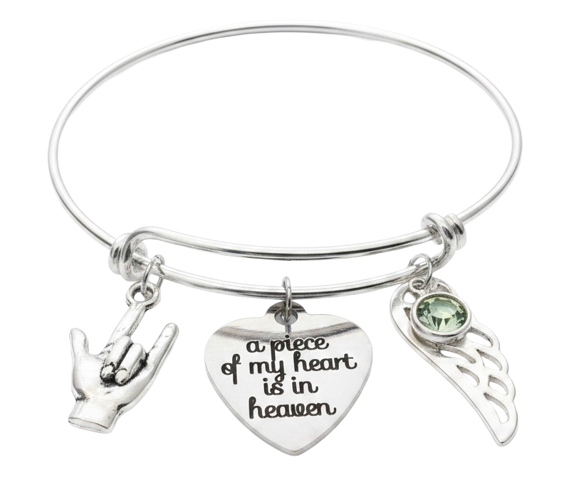 Silver memorial bangle bracelet with ASL I Love You hand sign charm, "a piece of my heart is in heaven" engraved heart, angel wing, and birthstone crystal