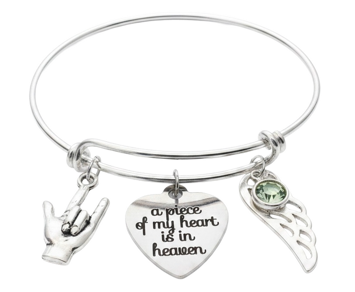 Silver memorial bangle bracelet with ASL I Love You hand sign charm, "a piece of my heart is in heaven" engraved heart, angel wing, and birthstone crystal