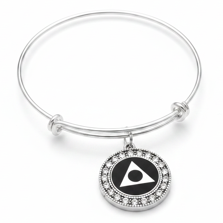 Silver expandable charm bangle with crystal-rimmed round black enamel Al-Anon AA sobriety symbol charm on white background – recovery gift for women by Jules Obsession