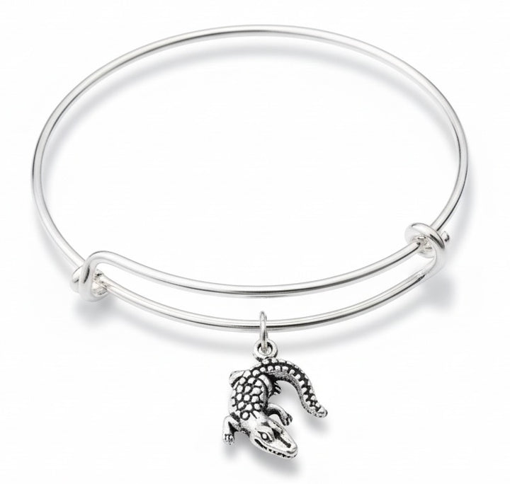 Silver alligator charm expandable bangle bracelet with detailed scaly gator charm on polished silver wire bangle by Jules Obsession