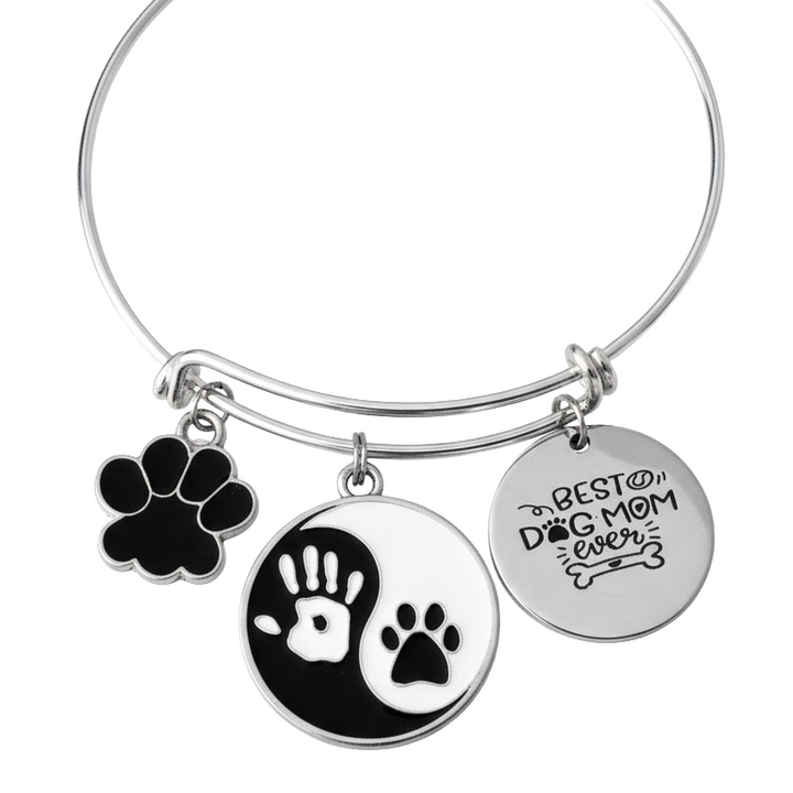 Silver expandable bangle bracelet with black enamel paw print charm, yin-yang human hand and dog paw disc charm, and "Best Dog Mom Ever" engraved disc charm – dog mom gift jewelry by Jules Obsession