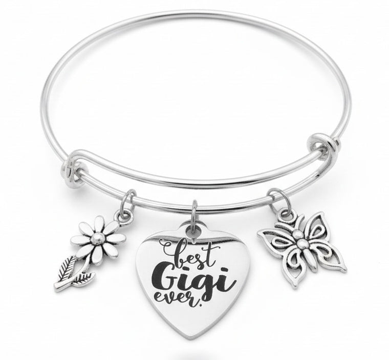 Silver bracelet with floral and butterfly charms on a white background Best Gigi Ever Bracelet – Silver Charm Bangle with Butterfly & Daisy | Gift for Gigi