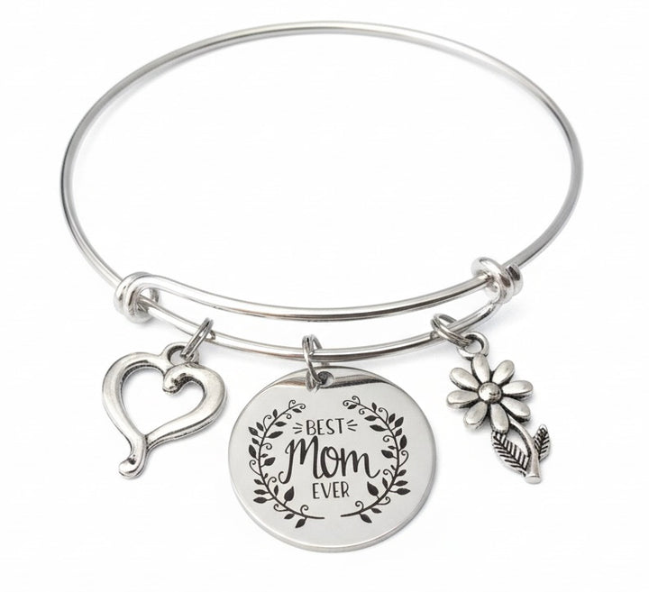 Silver expandable bangle bracelet with "Best Mom Ever" laurel wreath engraved disc charm, open heart charm, and daisy flower charm – Mother&