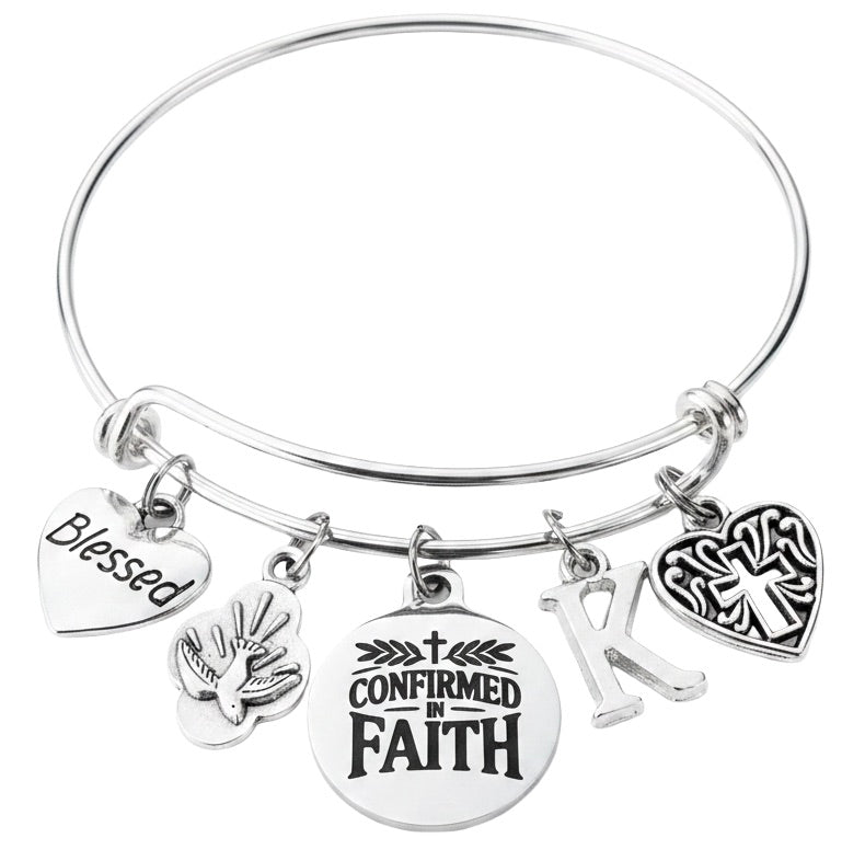 Silver-plated adjustable bangle bracelet featuring a stainless steel Confirmed in Faith medal, silver-plated Blessed heart charm, Holy Spirit Dove charm, Filigree Heart Cross charm, and personalized initial charm