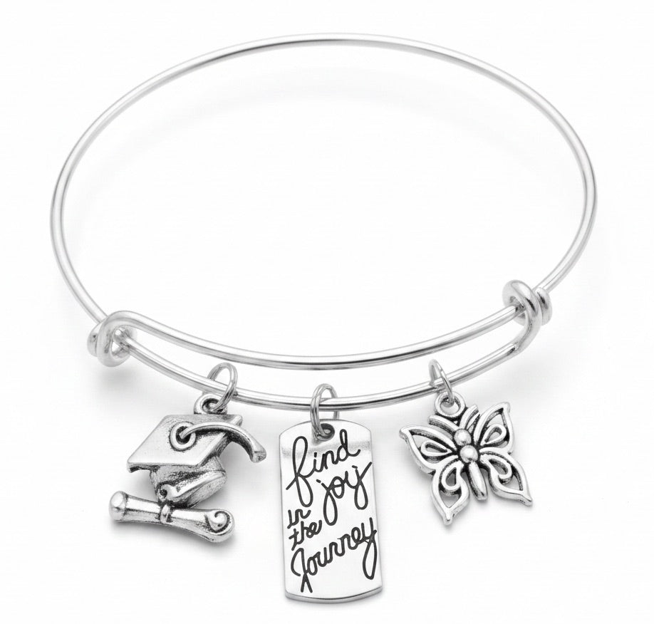 Silver graduation charm bracelet with Find Joy in the Journey stamped tag charm, graduation cap and diploma charm, and butterfly charm on adjustable silver bangle – Jules Obsession