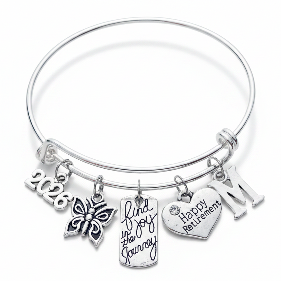 Silver expandable charm bangle with 2026 year charm, butterfly, Find Joy in the Journey tag, Happy Retirement heart, and initial charm – retirement gift for women by Jules Obsession"