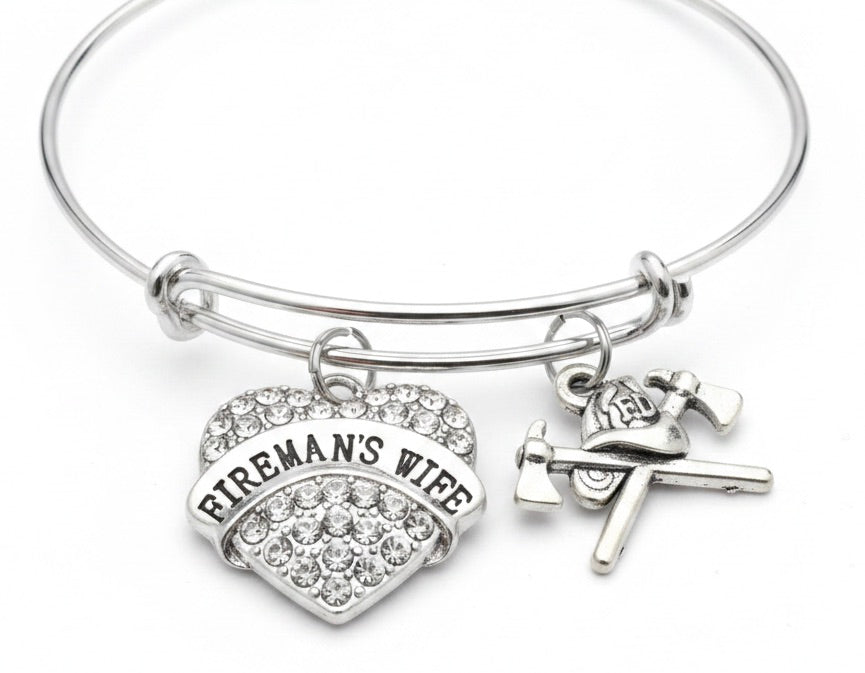 Silver expandable bangle bracelet with a sparkling crystal pave Fireman's Wife heart charm and silver firefighter helmet and crossed axe charm — meaningful gift for firefighter wife"