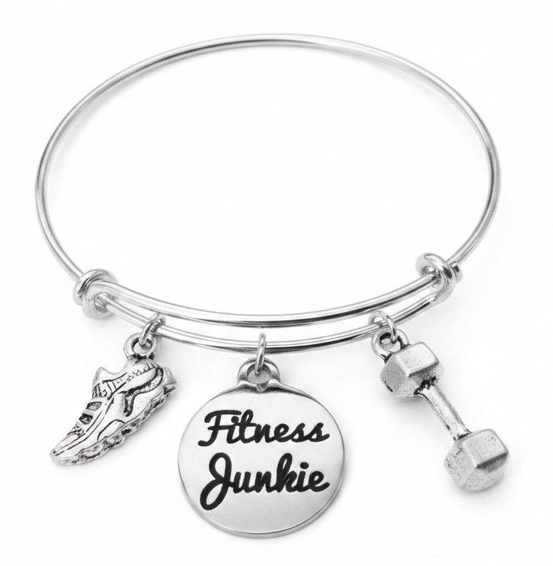 Silver expandable bangle bracelet with Fitness Junkie engraved disc charm, running shoe charm, and dumbbell charm on white background – Jules Obsession handmade gym and fitness jewelry gift for women