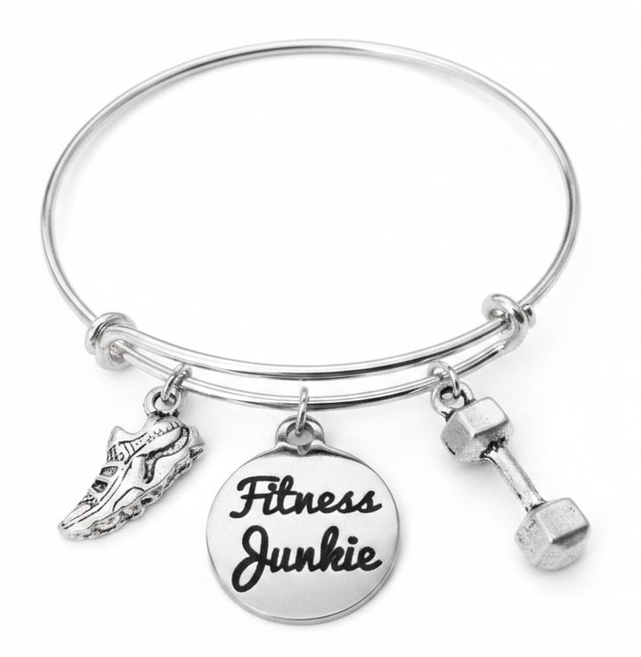 Silver expandable bangle bracelet with Fitness Junkie engraved disc charm, running shoe charm, and dumbbell charm on white background – Jules Obsession handmade gym and fitness jewelry gift for women