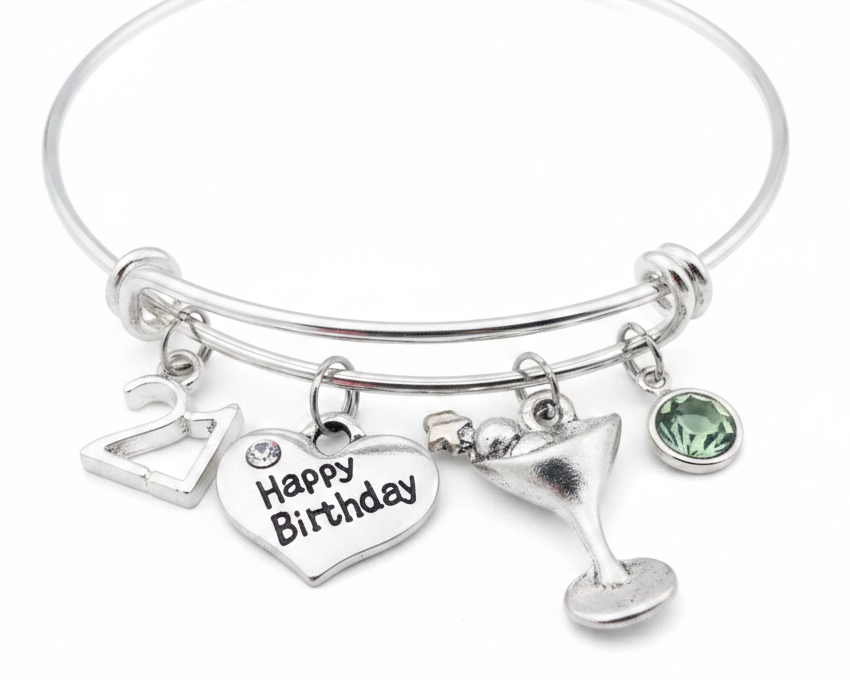 Jules Obsession 21st Birthday Charm Bracelet – adjustable silver-plated wire bangle with 21 charm, Happy Birthday heart charm, cocktail glass charm, and faceted crystal birthstone, hand-assembled in USA, ships in velvet jewelry pouch
