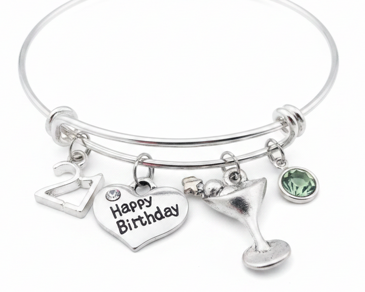 Jules Obsession 21st Birthday Charm Bracelet – adjustable silver-plated wire bangle with 21 charm, Happy Birthday heart charm, cocktail glass charm, and faceted crystal birthstone, hand-assembled in USA, ships in velvet jewelry pouch
