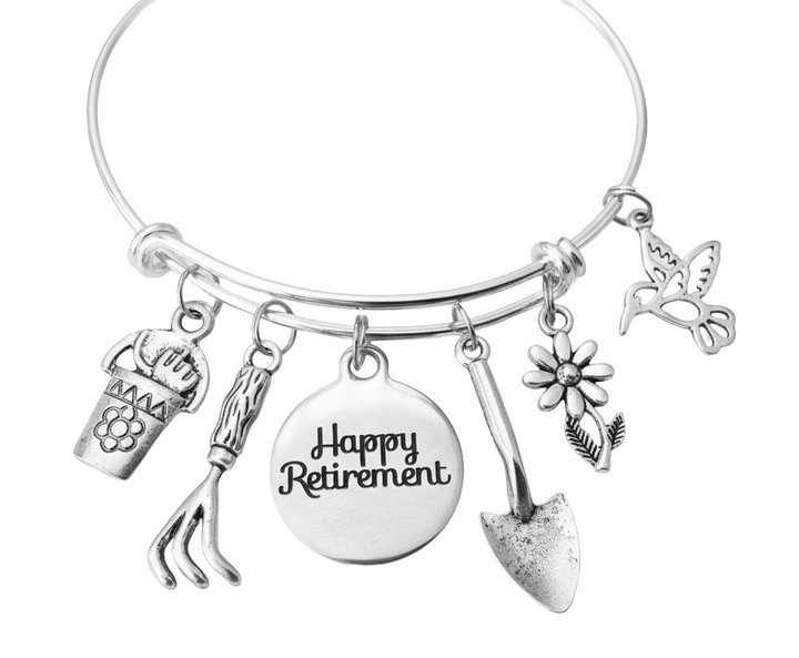 Happy Retirement garden charm bracelet with hummingbird, daisy, rake, trowel, flower pot and Happy Retirement disc charms on silver expandable bangle by Jules Obsession