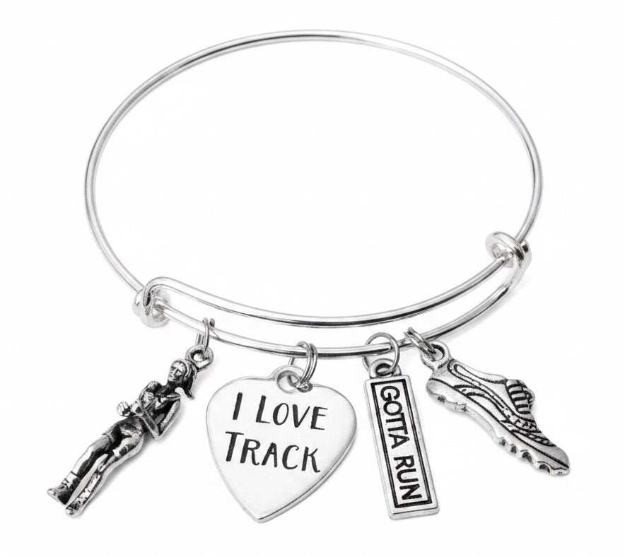 Silver expandable bangle bracelet with I Love Track heart charm, runner figure charm, Gotta Run tag charm, and winged running shoe charm on white background – Jules Obsession handmade track and field jewelry gift