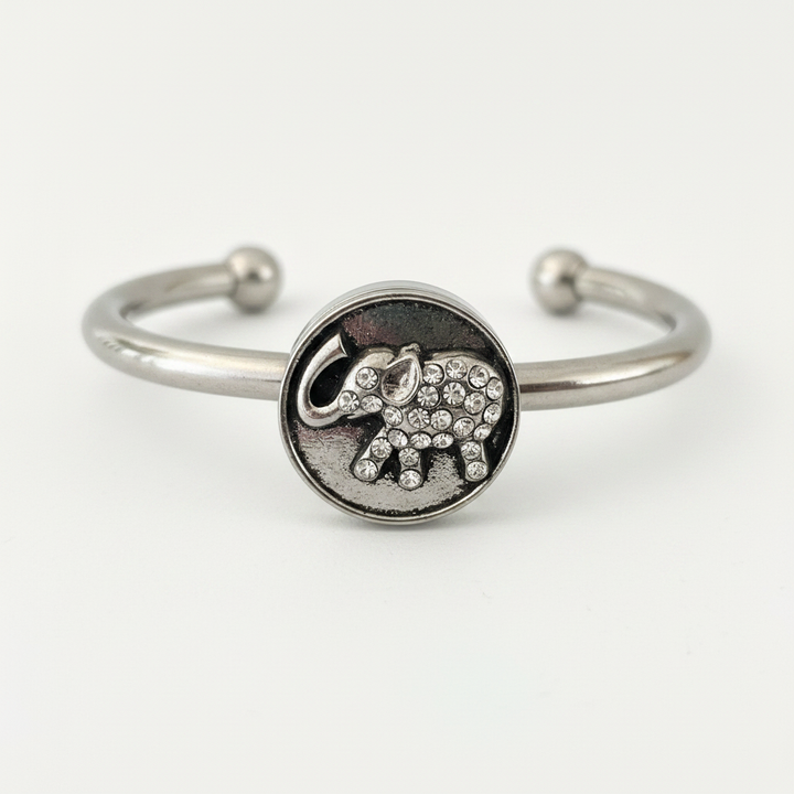 Close-up macro detail of crystal rhinestone elephant 18mm snap charm on stainless steel cuff bracelet – Jules Obsession