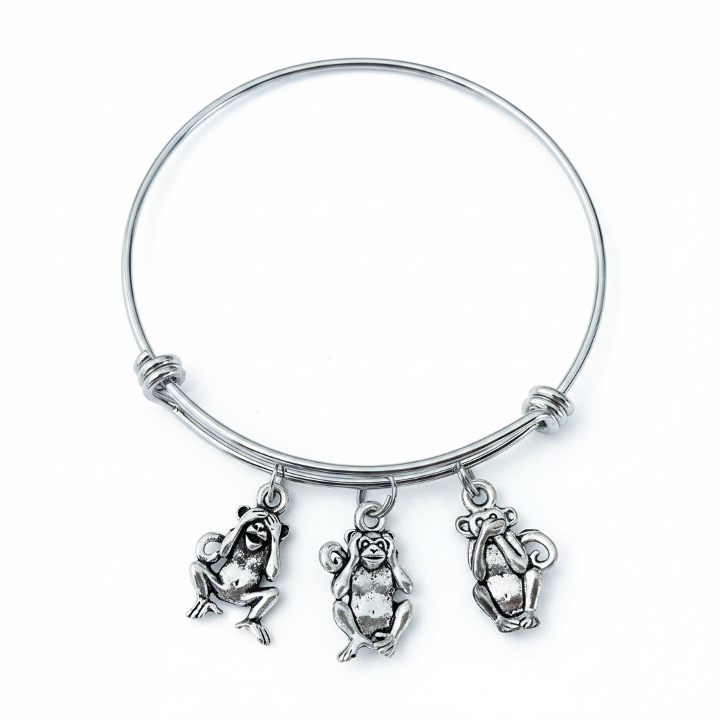 Silver expandable bangle bracelet with three antique silver see no evil hear no evil speak no evil monkey charms on white background – Jules Obsession handmade jewelry