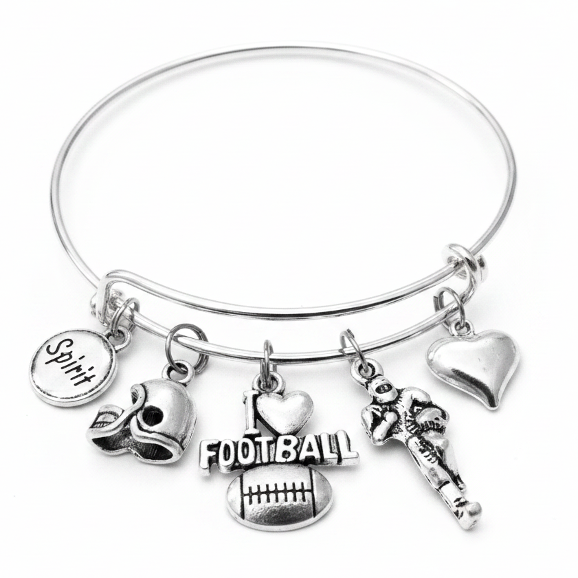 Silver expandable bangle bracelet with five football-themed charms: Spirit disc, football helmet, I Love Football charm, football player, and puffed heart charm on white background