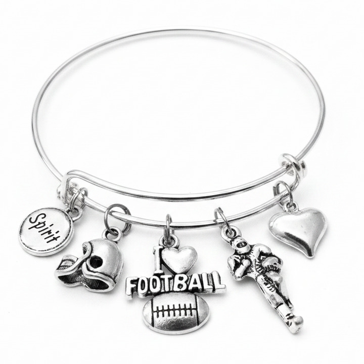 Silver expandable bangle bracelet with five football-themed charms: Spirit disc, football helmet, I Love Football charm, football player, and puffed heart charm on white background