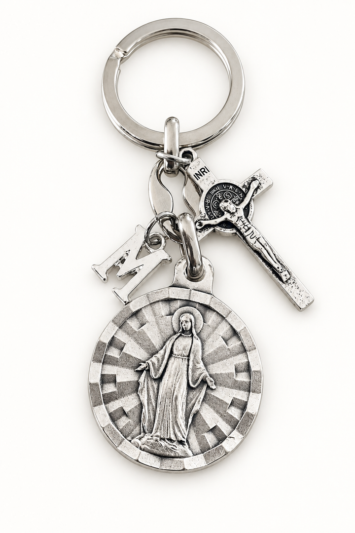 Silver-tone keychain with a Virgin Mary medal, detailed crucifix, and smaller stamped religious charms.