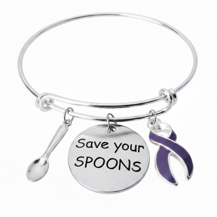 Silver expandable bangle bracelet with spoon charm, Save Your Spoons engraved disc charm, and purple enamel awareness ribbon charm on white background - Jules Obsession