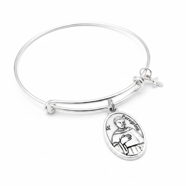St. Peregrine relic medal silver expandable charm bracelet on white studio background — Catholic cancer saint gift