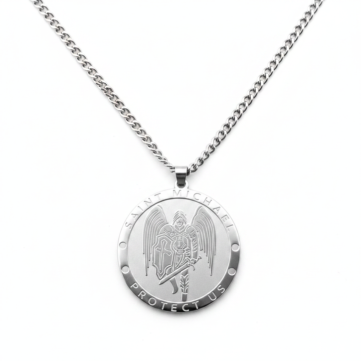 Saint Michael Protect Us round stainless steel archangel medal pendant necklace on silver curb chain, white background