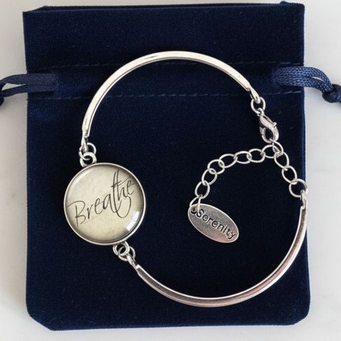 Breathe and Serenity silver cuff bracelet gift-ready in dark velvet jewelry pouch – mindfulness gift by Jules Obsession