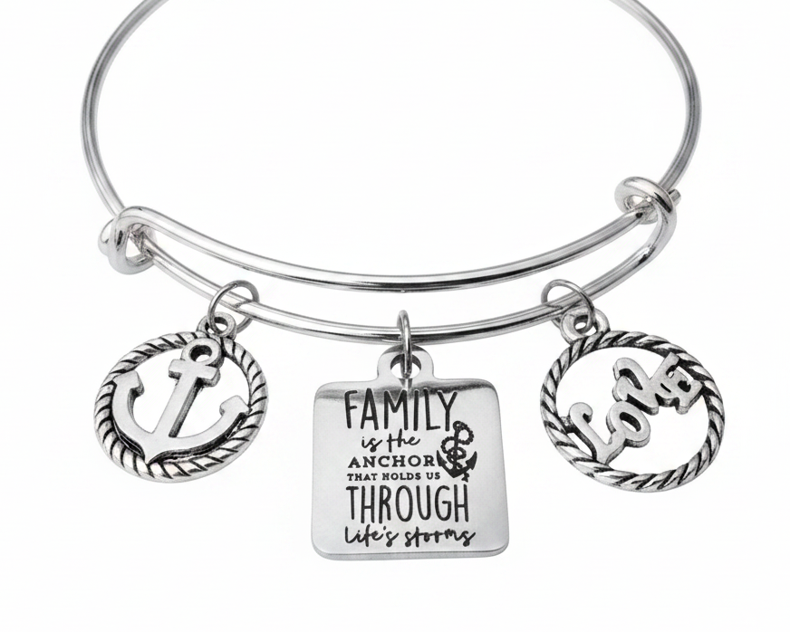Silver expandable bangle bracelet with three charms: rope-border anchor charm, engraved square tag reading Family is the Anchor That Holds Us Through Life&