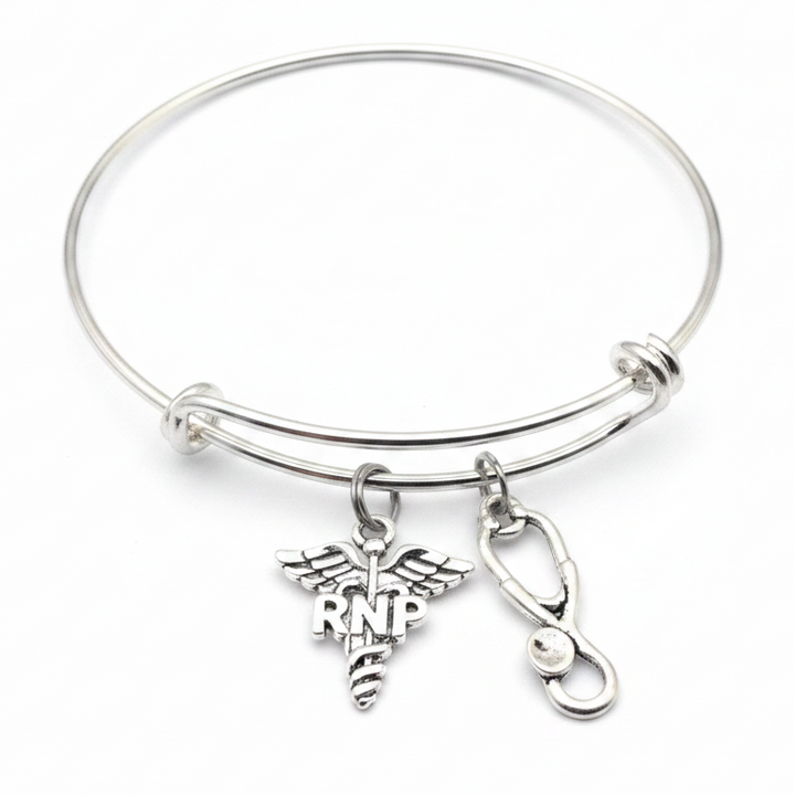 Silver expandable bangle bracelet with RNP caduceus charm and stethoscope charm on white background – Jules Obsession registered nurse practitioner gift jewelry
