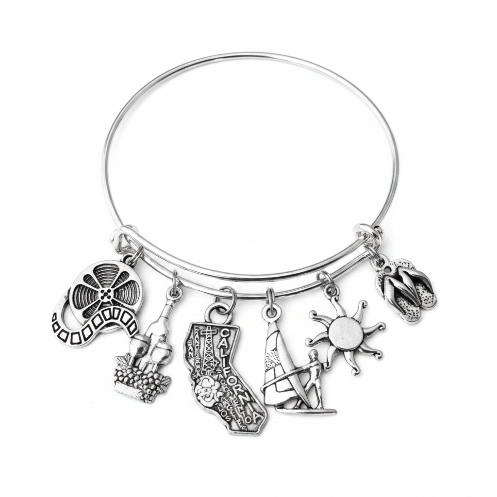 Silver expandable bangle bracelet with six California-themed charms: film reel, wine bottle with grapes, California state shape with city names, windsurfer, sun, and flip flops — adjustable stackable gift bracelet for California lovers and women