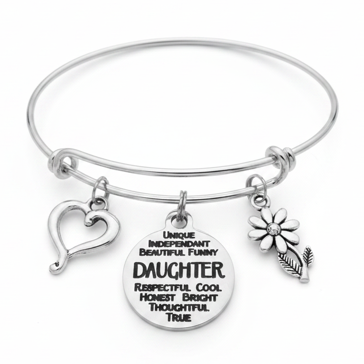 Silver expandable bangle bracelet with engraved Daughter quote disc charm, open heart charm, and daisy flower charm on white background – daughter gift by Jules Obsession