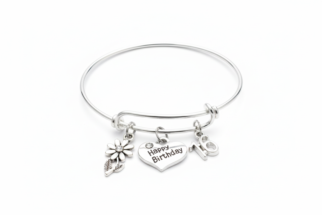 Sweet 16 birthday charm bracelet with Happy Birthday heart flower and number 16 charms on bright silver expandable bangle