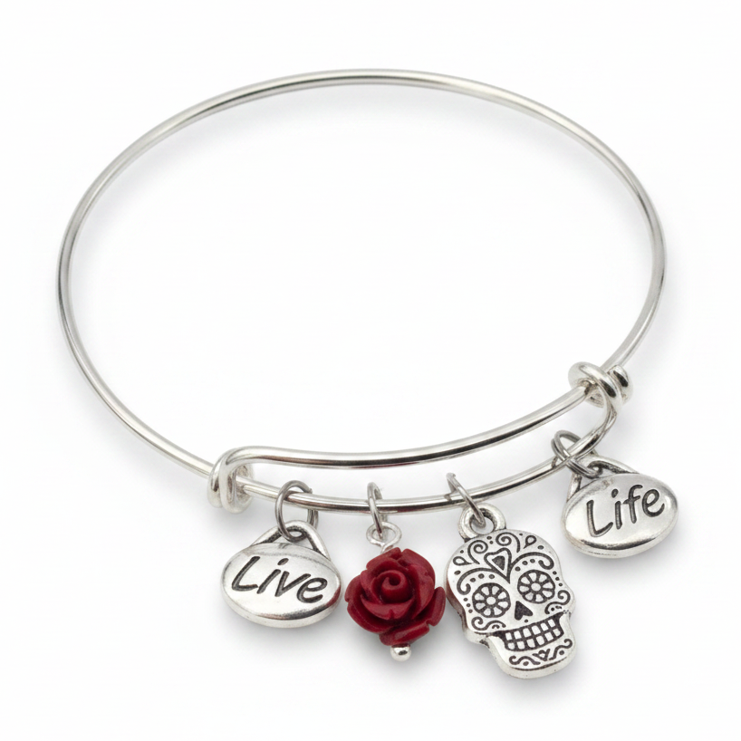 Silver expandable wire bangle bracelet on white background featuring Live word charm, deep red rose bead, detailed sugar skull charm with floral eye designs, and Life word charm