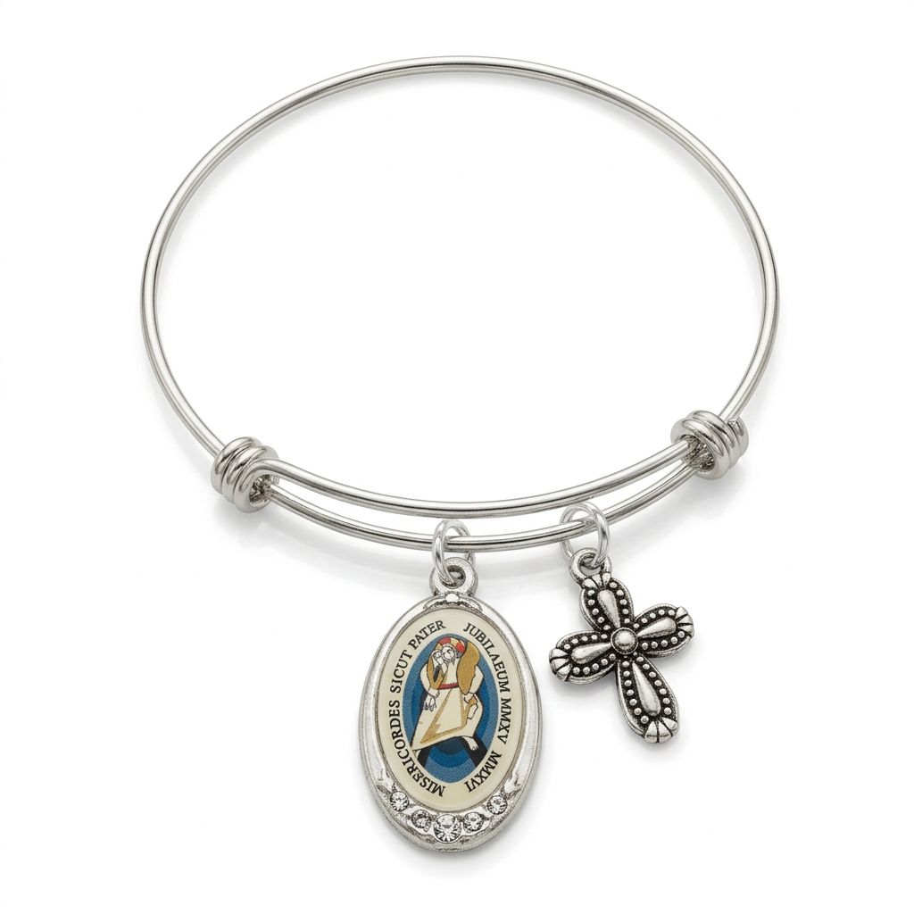 Expandable stainless steel bangle with colored Jubilee of Mercy enamel medal, clear crystal accents, and ornate silver cross on a white background.