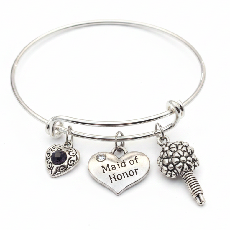 Silver expandable bangle bracelet with Maid of Honor heart charm, bridal bouquet charm, and filigree crystal heart charm on white background - Jules Obsession