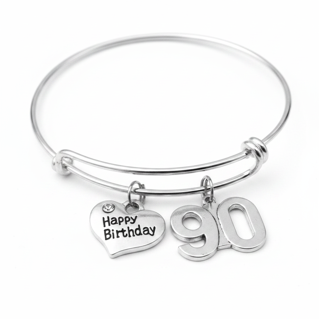 Silver expandable charm bangle bracelet with Happy Birthday heart charm featuring crystal accent and bold 90 number charm, displayed on white background — 90th birthday gift for women by Jules Obsession