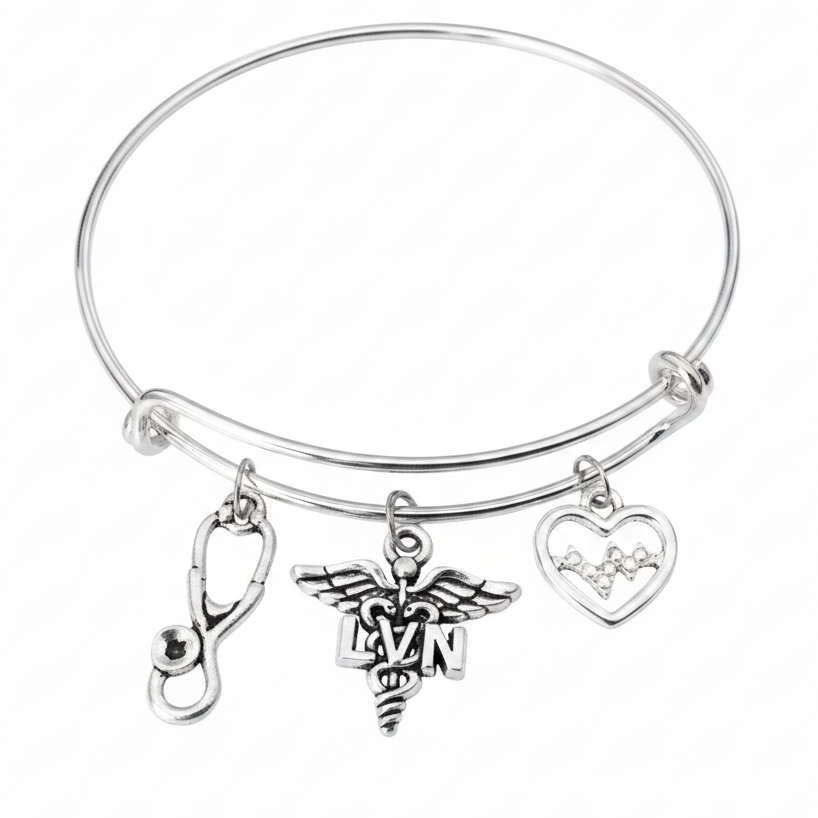 Silver expandable bangle bracelet with LVN caduceus charm, EKG heartbeat heart charm, and stethoscope charm on white background — licensed vocational nurse gift jewelry