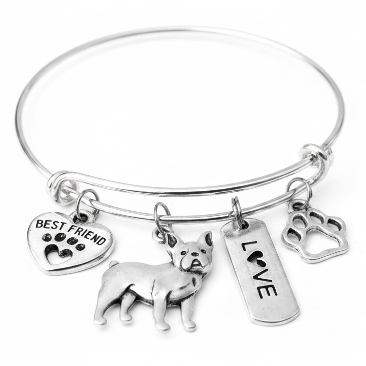 Silver expandable bangle bracelet with four French Bulldog charms — Best Friend heart, Frenchie dog, Love tag, and paw print — on white background, handcrafted dog mom jewelry gift by Jules Obsession