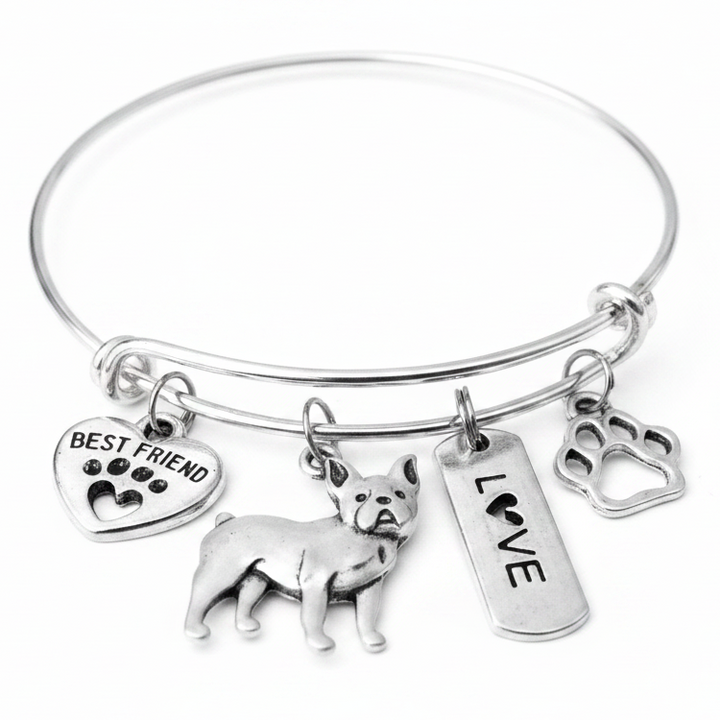 Silver expandable bangle bracelet with four French Bulldog charms — Best Friend heart, Frenchie dog, Love tag, and paw print — on white background, handcrafted dog mom jewelry gift by Jules Obsession
