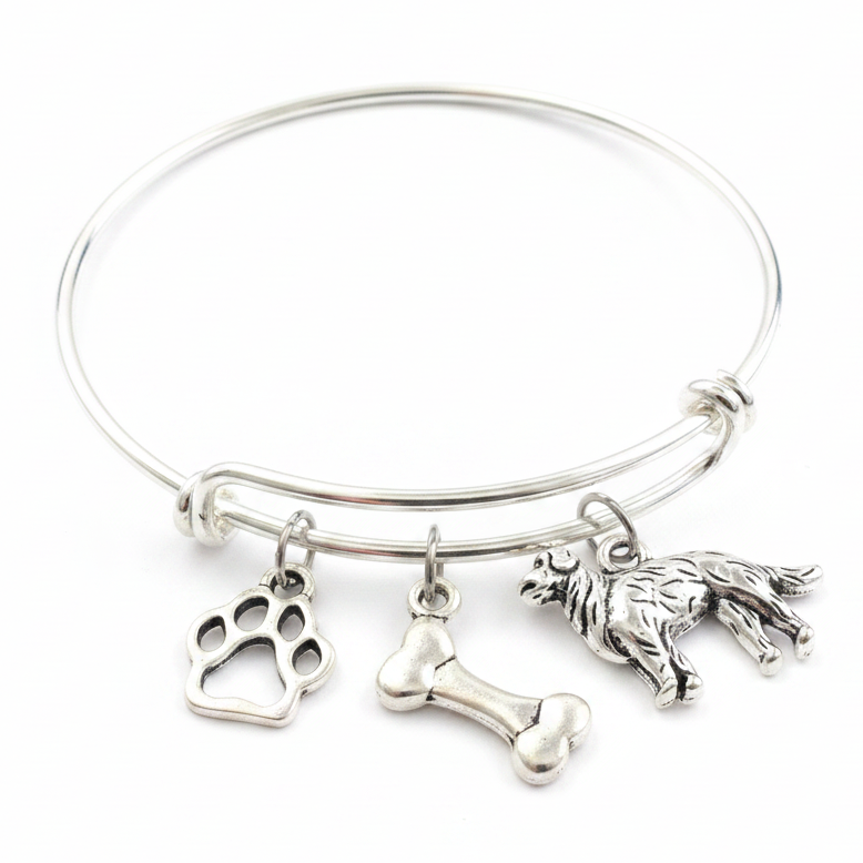 Silver expandable bangle bracelet with Labrador Retriever dog charm, paw print charm, and dog bone charm on white background – Jules Obsession dog lover jewelry gift
