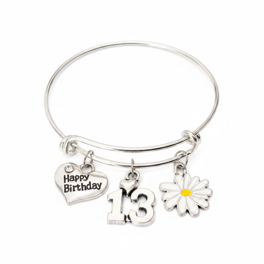 Silver expandable bangle bracelet with three charms: Happy Birthday heart charm with crystal accent, silver number 13 charm with tiny heart, and white daisy enamel charm with yellow center — adjustable stackable 13th birthday gift bracelet for teen girls